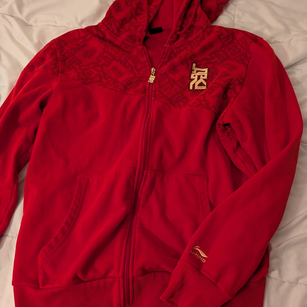 Red Zip-Up Hoodie with Gold Accents
